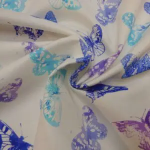 Curtain Canvas Fabric Poppin Butterflies Ivory Blue