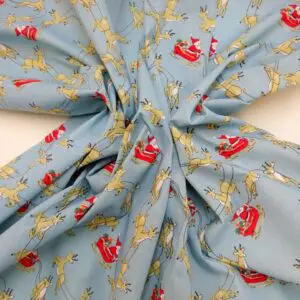 Christmas Fabric Polyester Cotton Dashing Reindeers Sky Blue