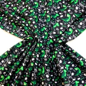 Brushed Cotton Fabric Extinct Jurassic Dinosaurs Black/Emerald