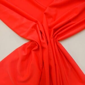 Lycra Fabric Plain Matt Coral Skinny Weave