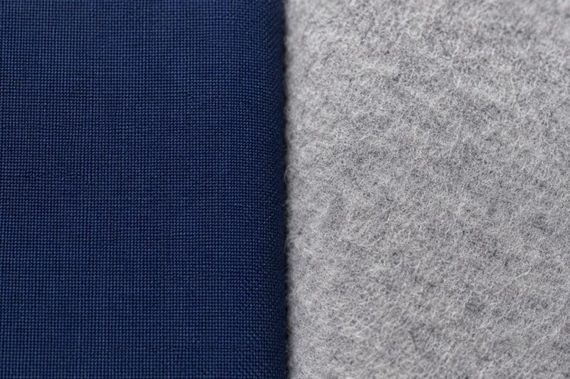 Close up showing the smooth texture of standard cotton next to fuzzy brushed cotton