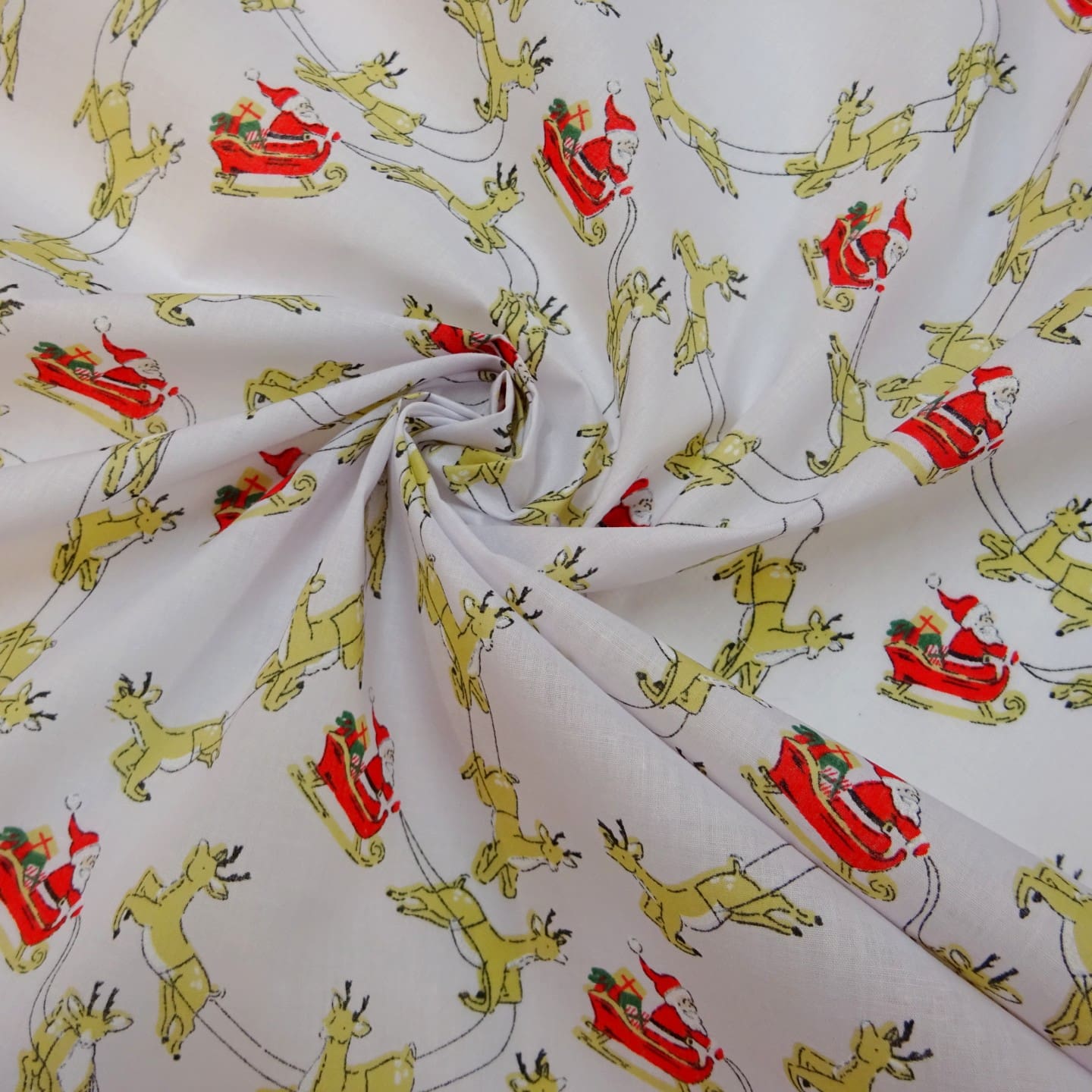 Christmas Fabric Polyester Cotton Dashing Reindeers White