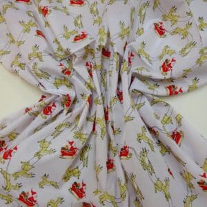 Christmas Fabric Polyester Cotton Dashing Reindeers White